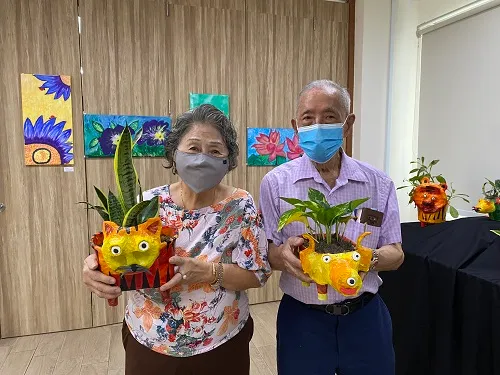 Seniors holding their crafts