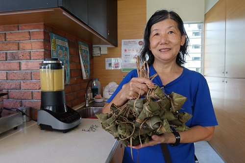 Lily holding rice dumplings